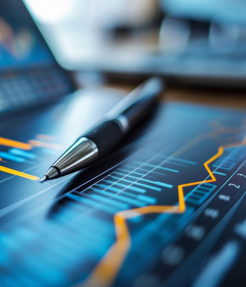 A pen on a tablet screen with financial data.